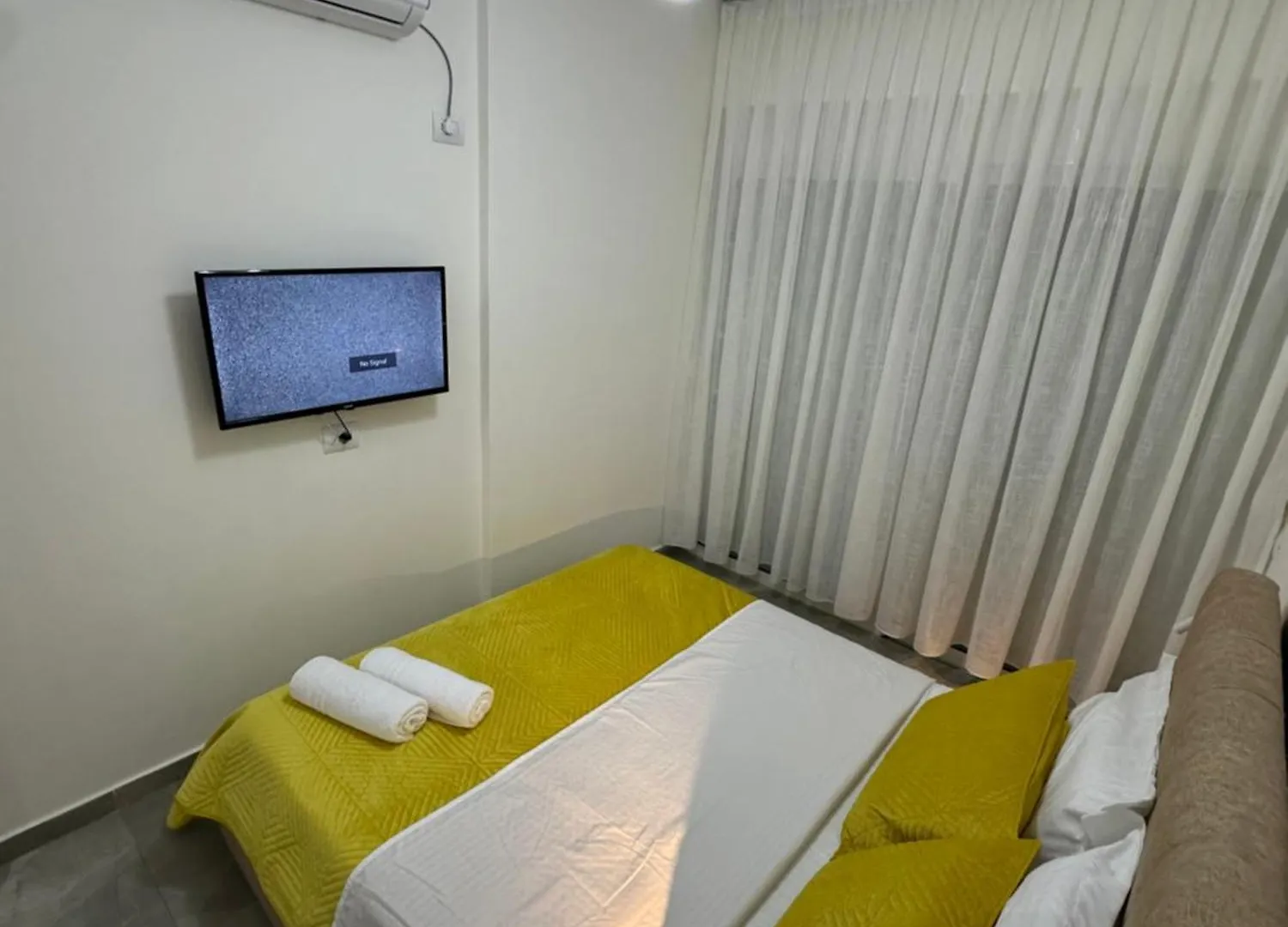 اتصالات Em Apartments 